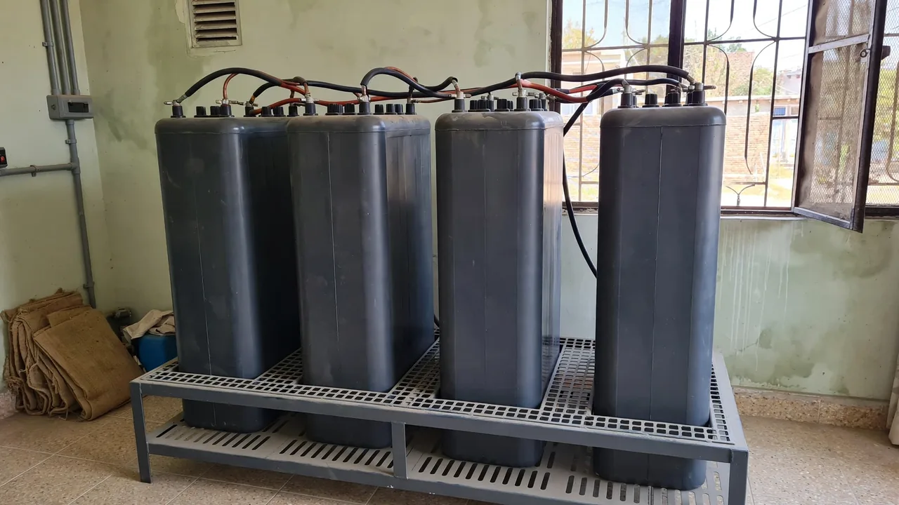 Tall tubular battery bank for solar Tall tubular deep-cycle battery bank wired with heavy cables for a solar power system